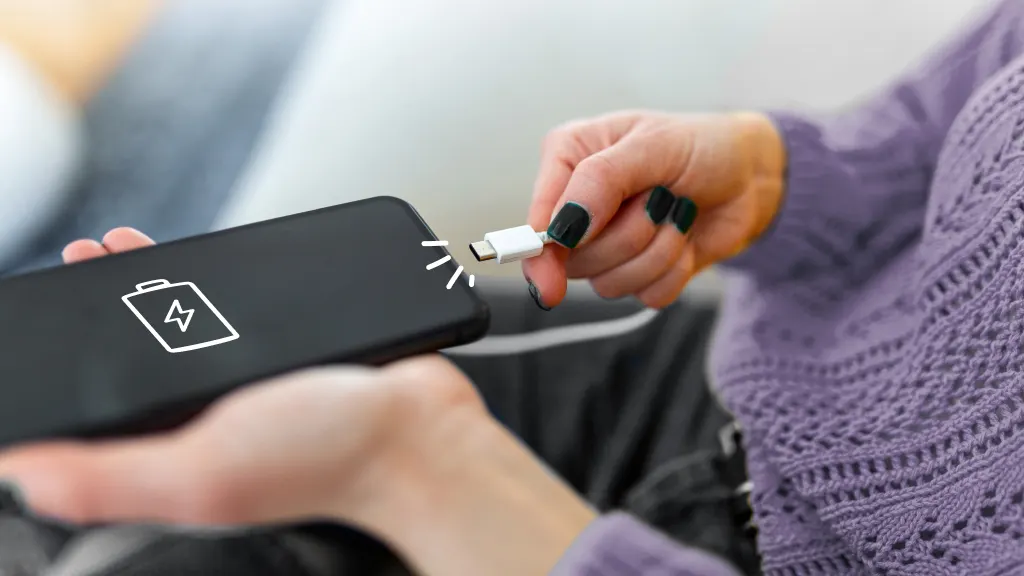 Person charing phone battery