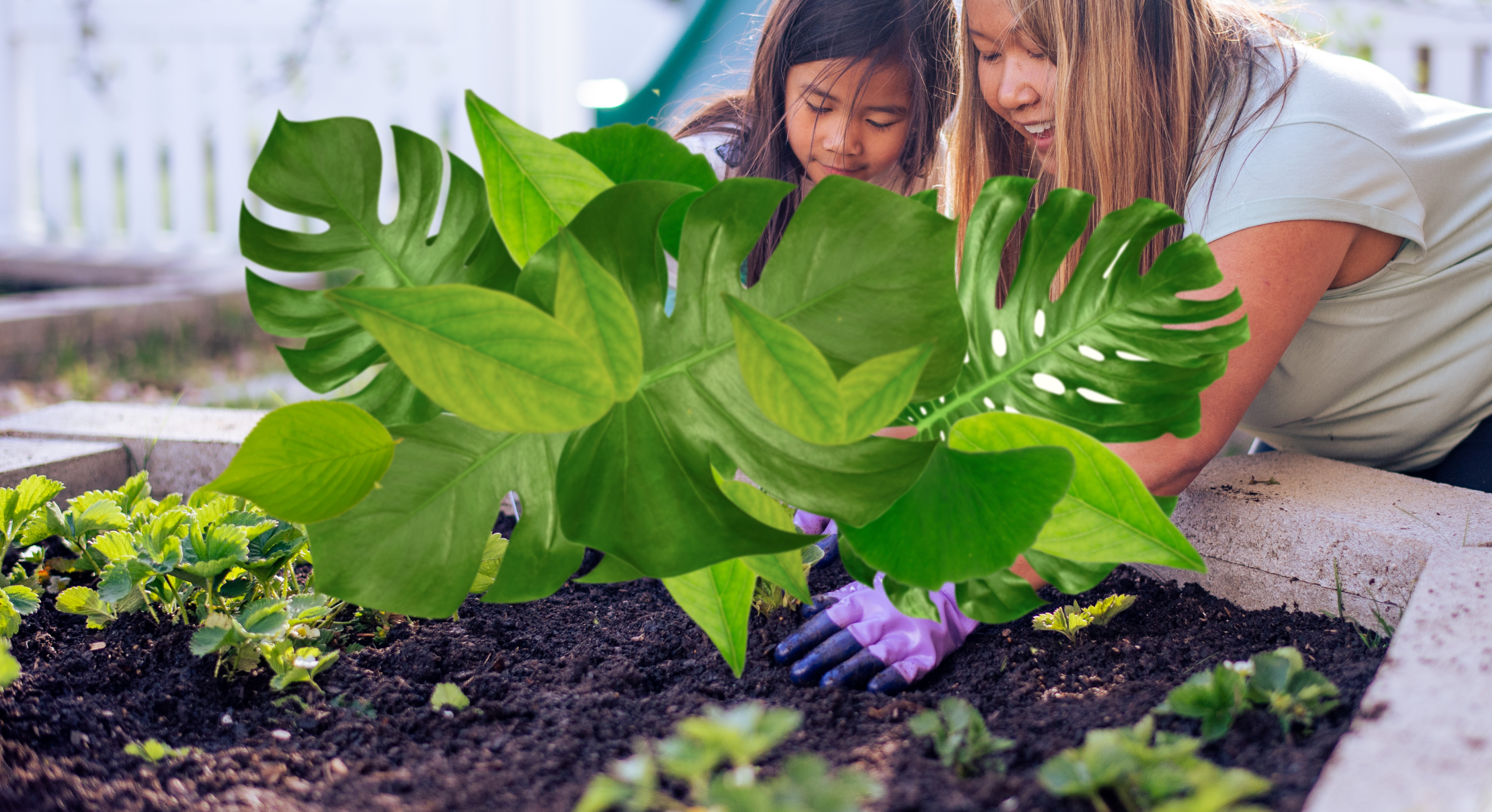 mother and daughter planting seeds
