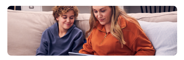 Woman using a tablet on a couch